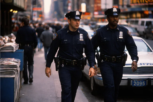 Paul J Mauro early NYPD career represented by patrol officers walking New York City streets in the late 1980s